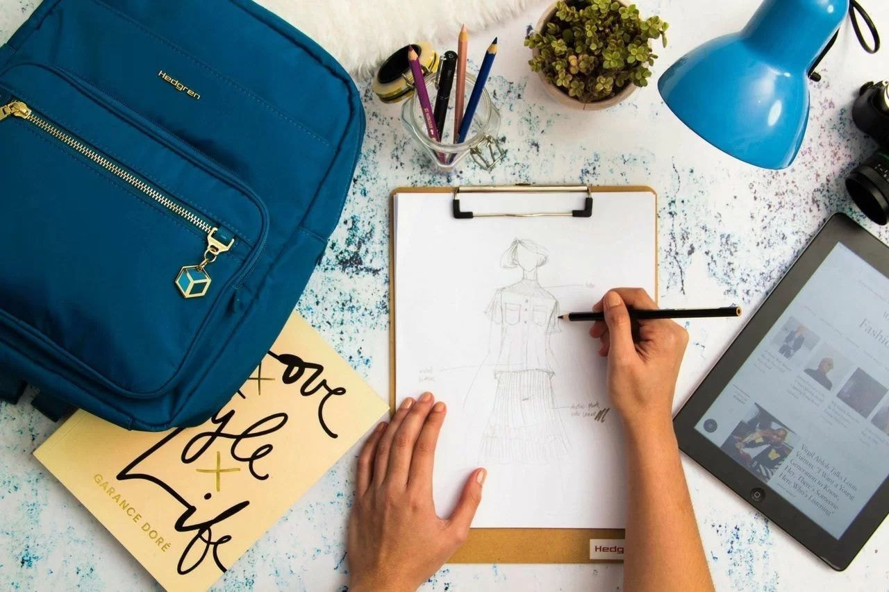 a person drawing on a clipboard